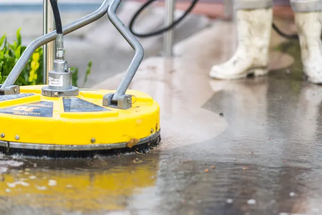 Surface cleaner pressure washing a concrete pad